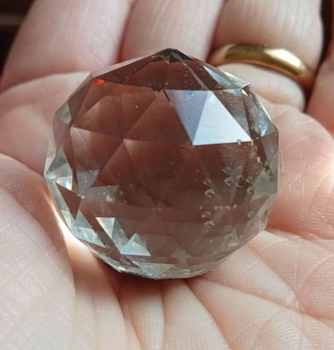 A crystal and a Wade Whimsie product bought at Bay Search & Rescue Charity Shop for £1.50
