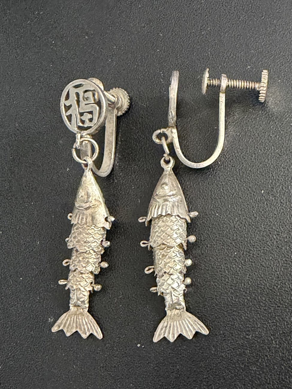 Articulated fish screw back earrings bought at Antique & Vintage by Luca De Luca for £9.00