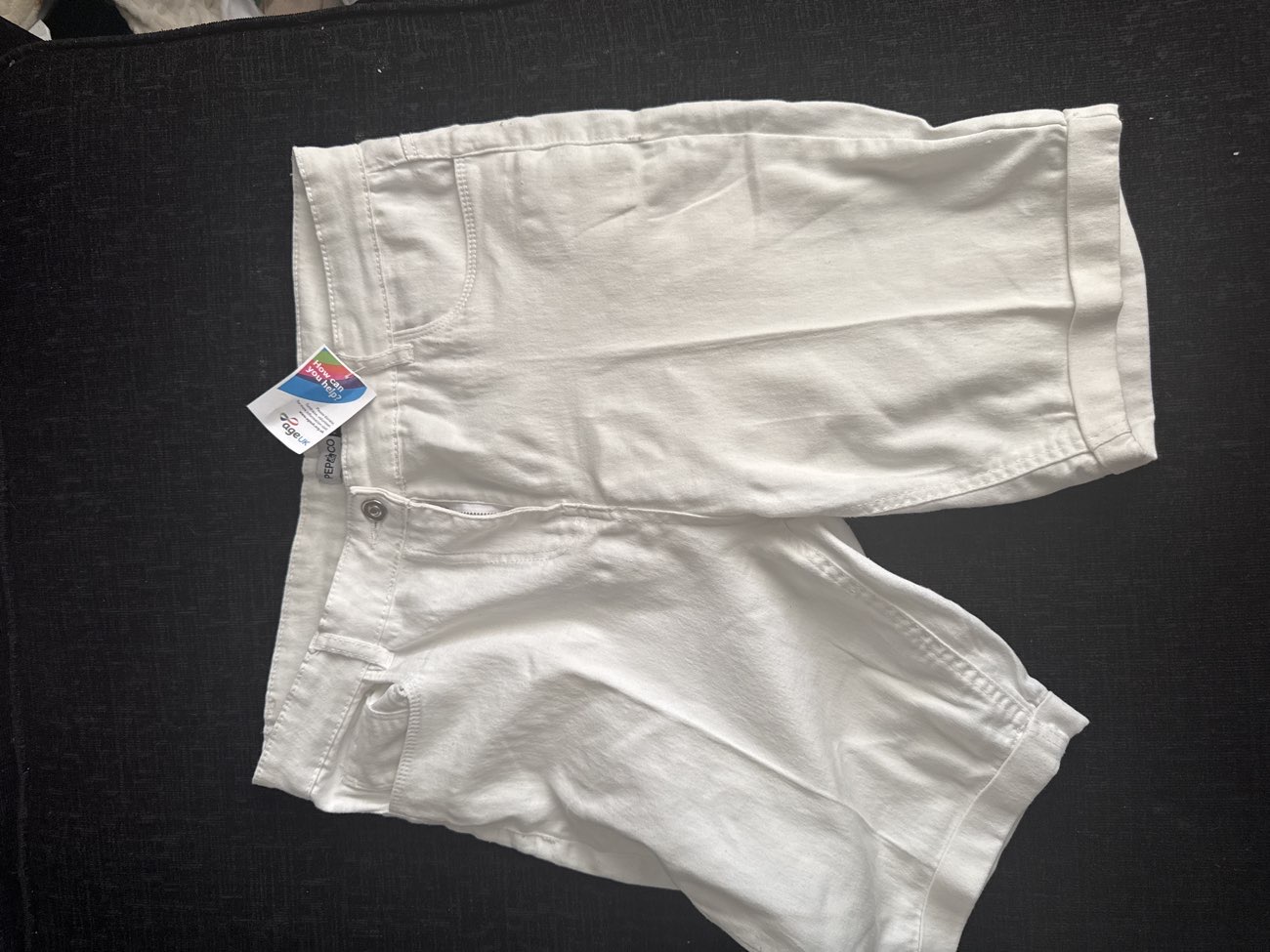 White jorts bought at Age UK Charity Shop for £2.00