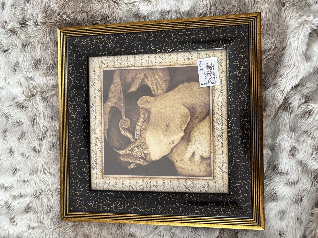Black and Gold picture frame bought at Tenovus Cancer Care for £2.99