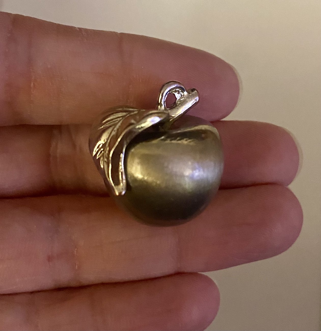 Metal apple trinket/pendant bought at Age UK Charity Shop for £1.00
