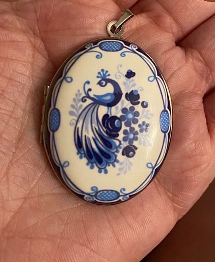 Huge locket. Might put the tiny wooden dogs I also got from here inside it. product bought at Helianthus emporium