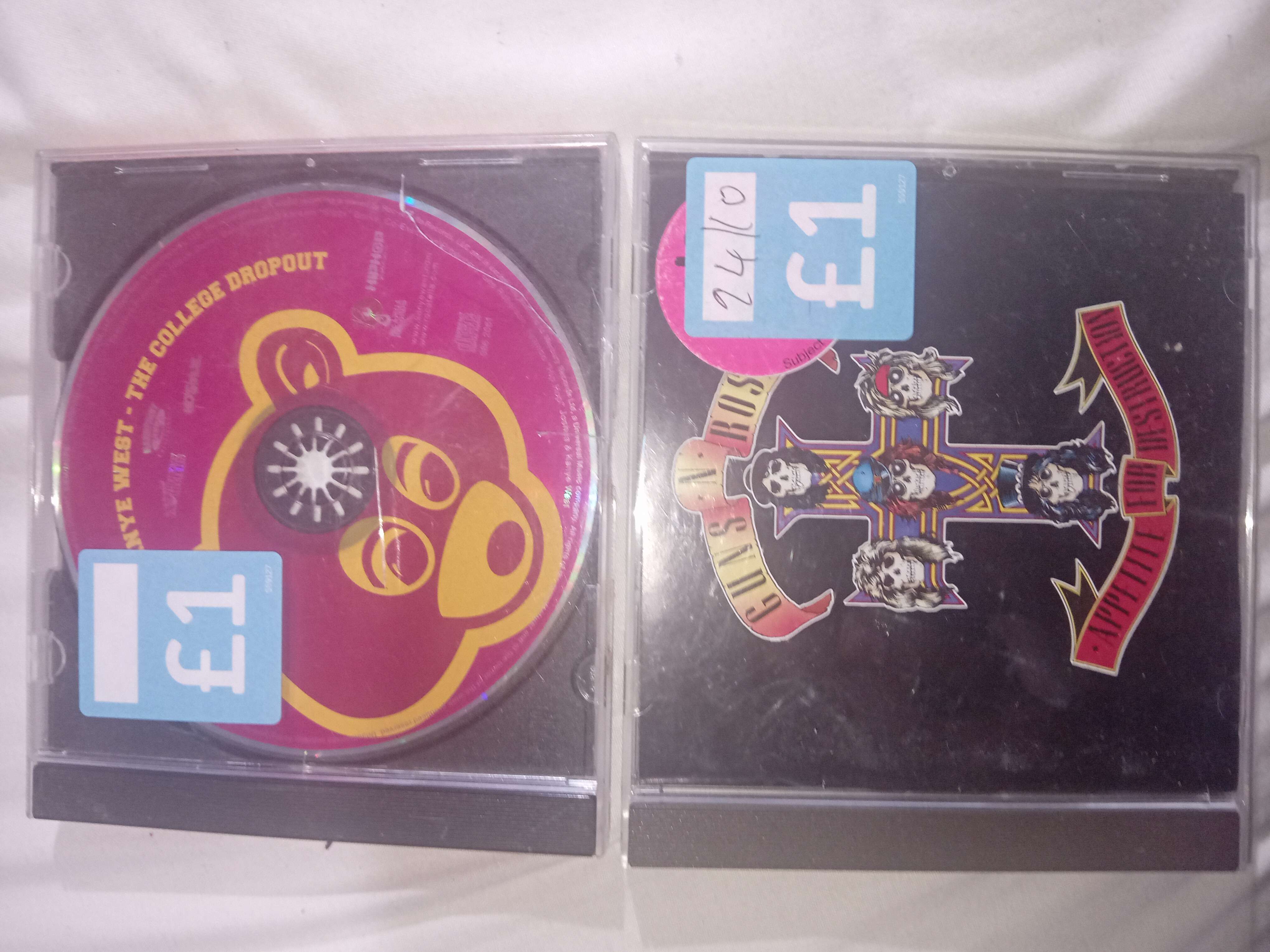 Kanye West The college dropout and Guns n Rose's Appetite for Destruction bought at Cancer Research UK for £2.00