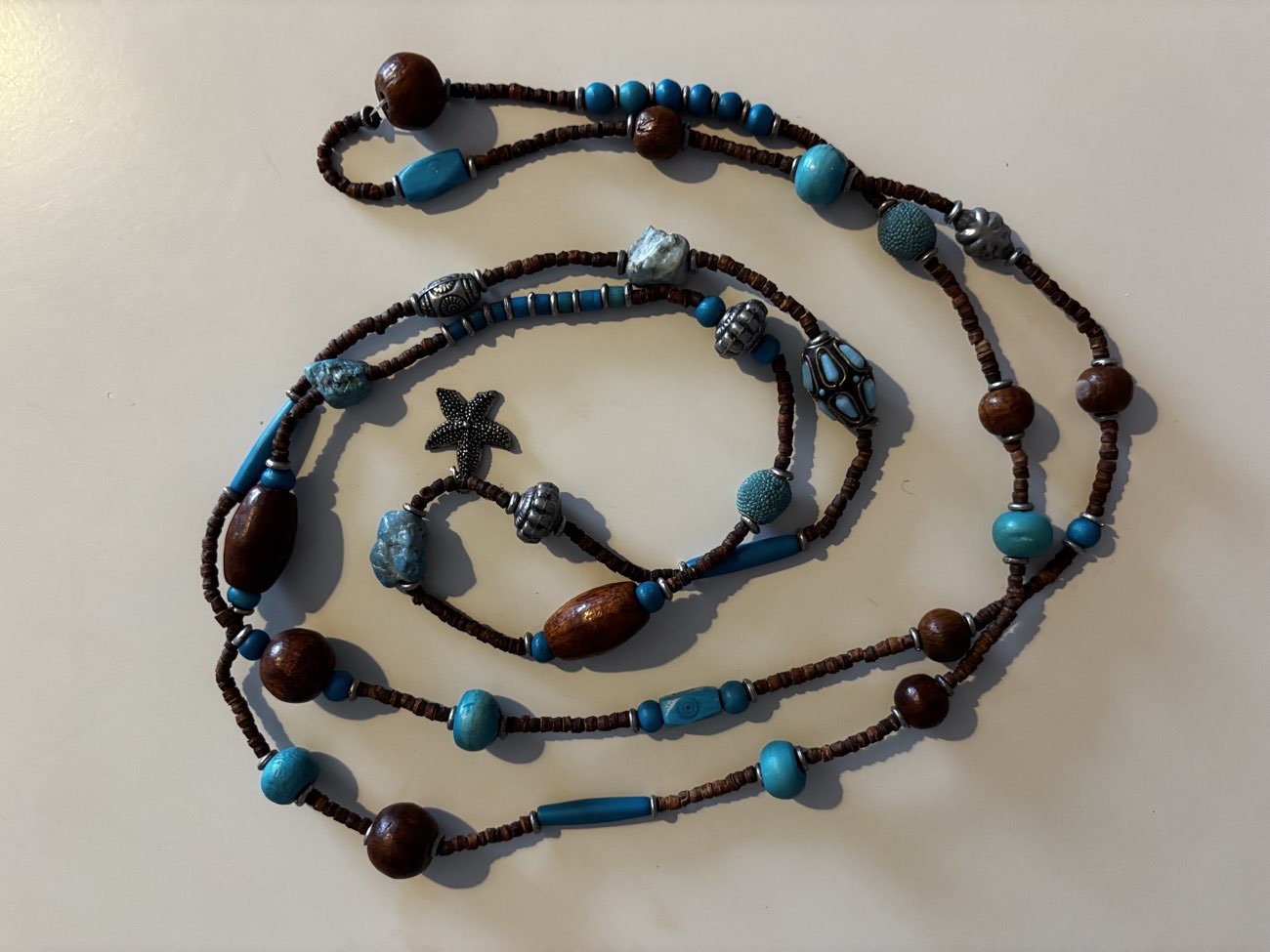 turquoise and brown long necklace bought at St Wilfrid's Hospice Charity Shop for £3.00