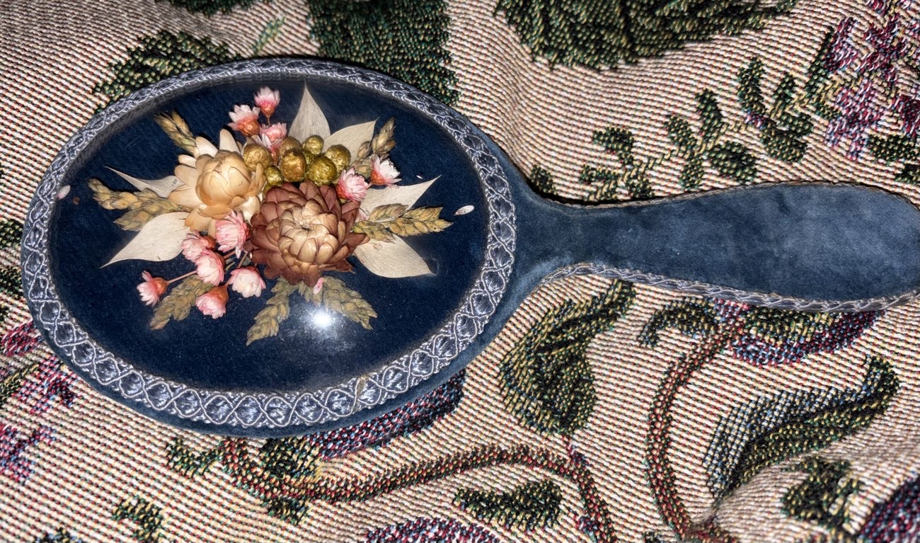 Hand mirror with dried flowers back bought at Leominster Antique Market for £10.00