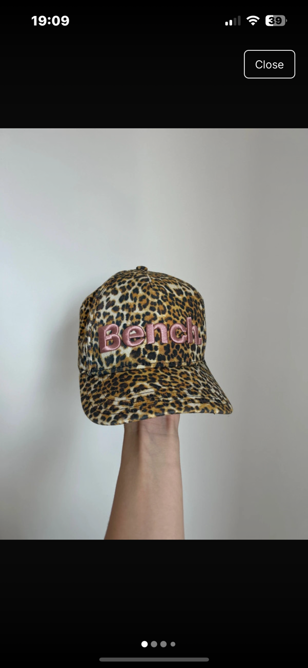 leopard print cap bought at Oxfam Shop for £6.00