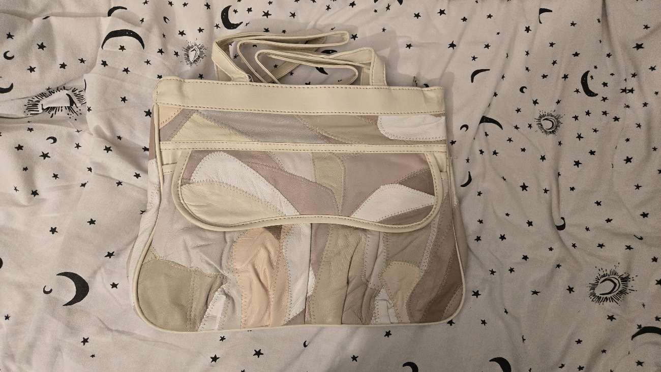 100% leather patchwork bag!! so cute and the leopard print lining is so!!! bought at The Children's Trust Shop for £7.50