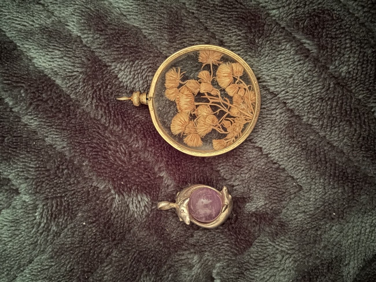 Dolphin and glass locket pendants. £10 each. I think the dolphins may be silver. bought at Twyford Antique Centre for £20.00