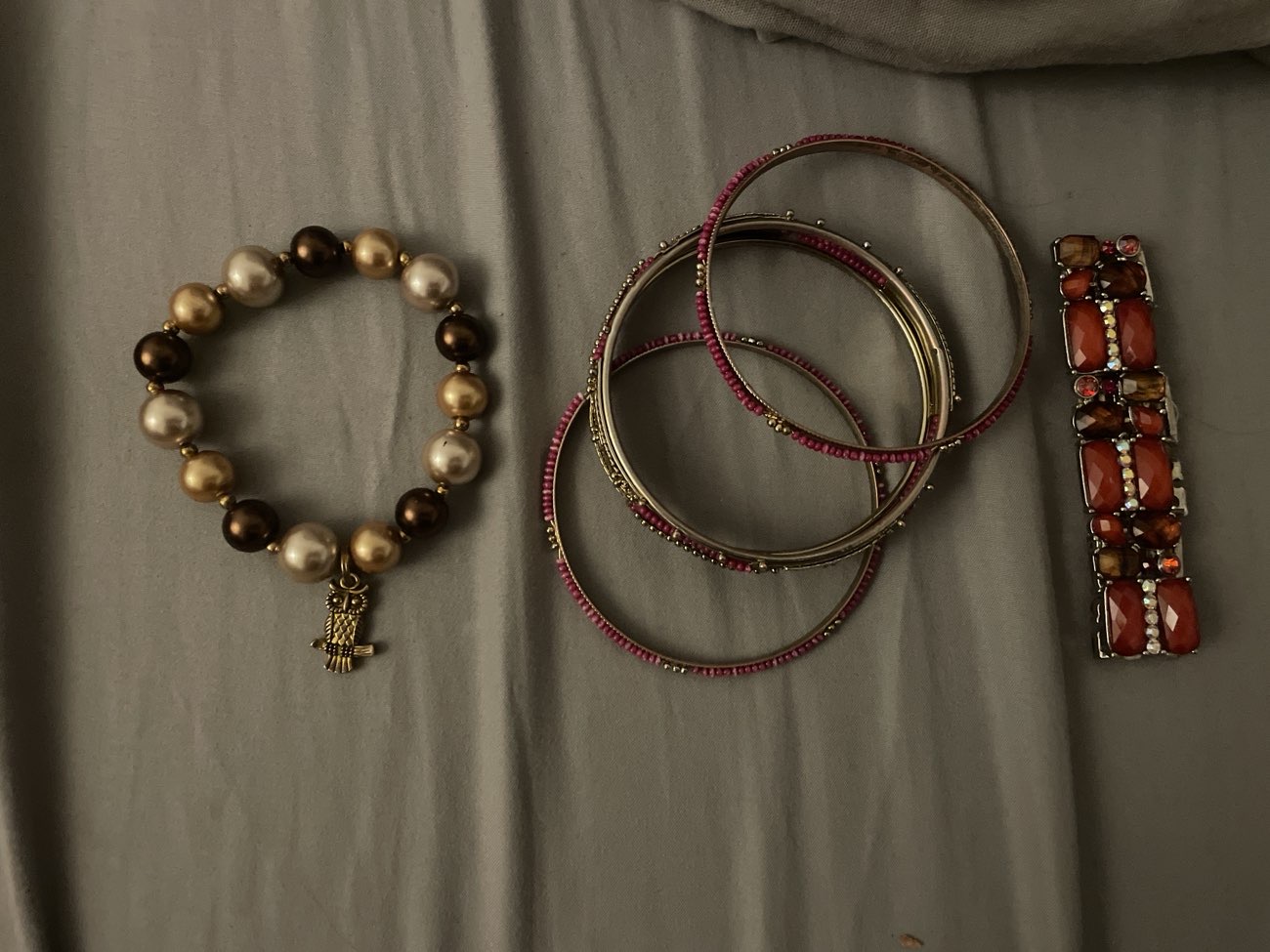 Bracelets £2.50-£3.50, red one little bit damaged & elastic breaking. Good condition though! bought at Thames Hospice