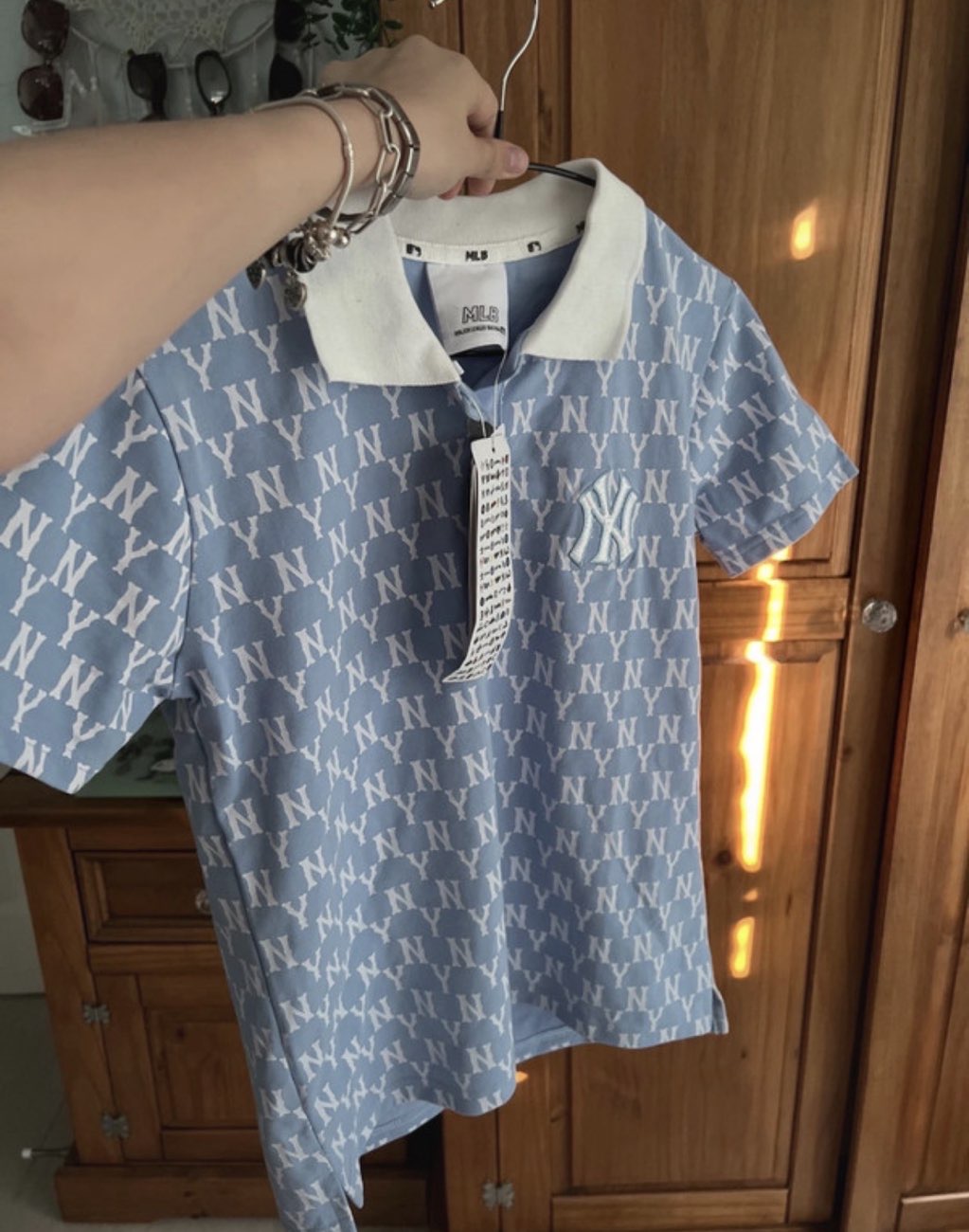 MLB baby blue polo shirt in size small still with original tags bought at Human Relief Foundation for £7.00