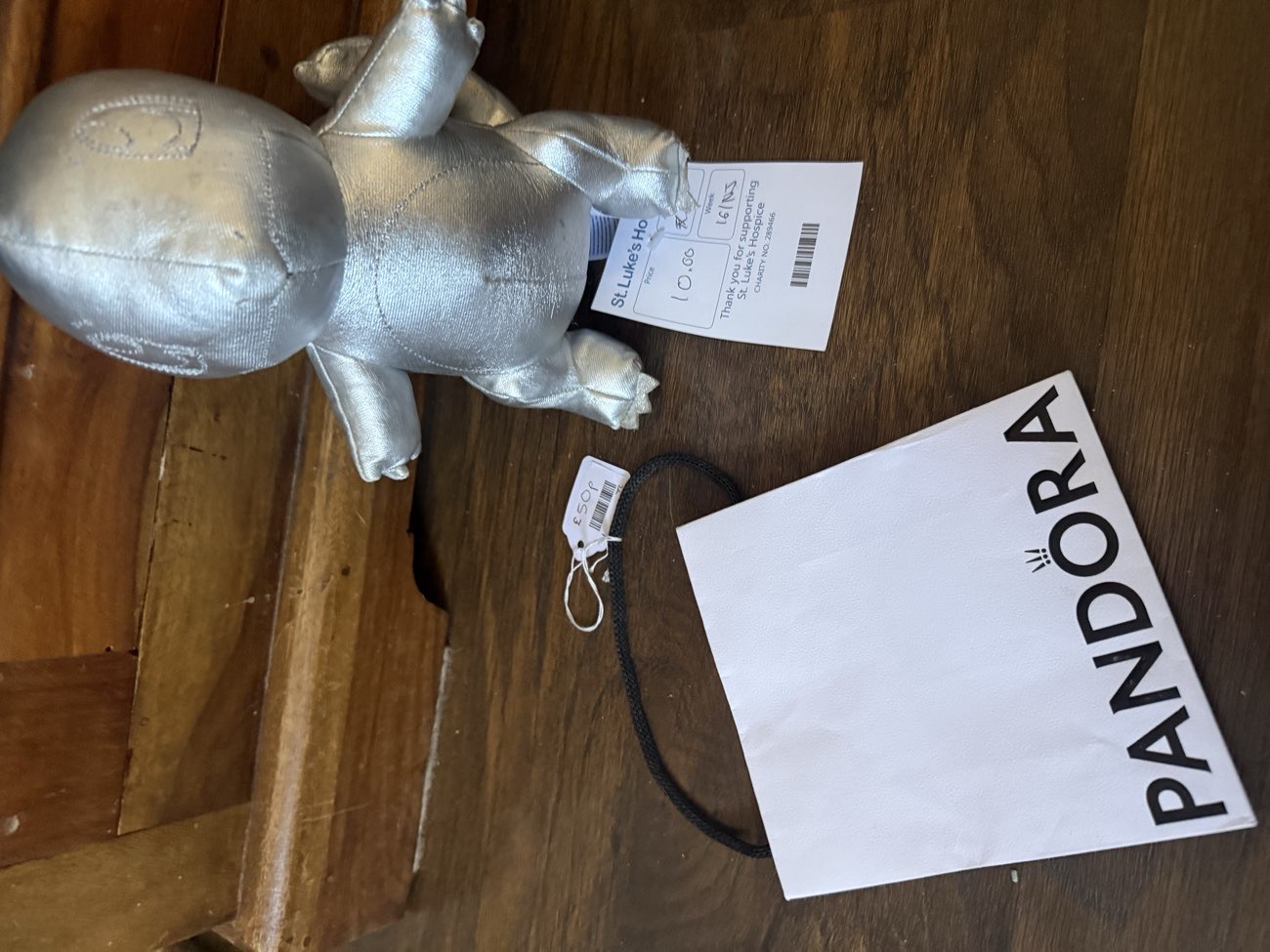 Silver charmander plushie and Pandora bag, been after one for my charm bracelet 🥹 bought at St Luke's Hospice for £10.50