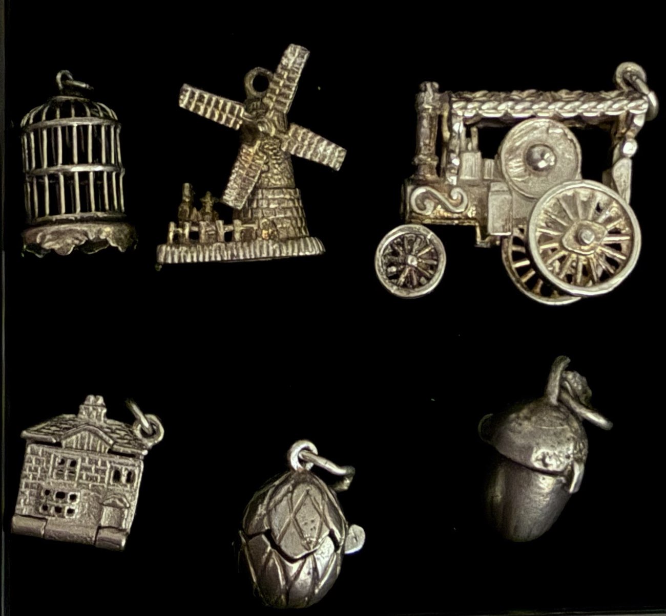 Silver charms.Bird in cage.Moving windmill.Steam tractor.Dollhouse.Chick in egg. Squirrel acorn product bought at Magpie (Manchester House) Ltd for £69.00