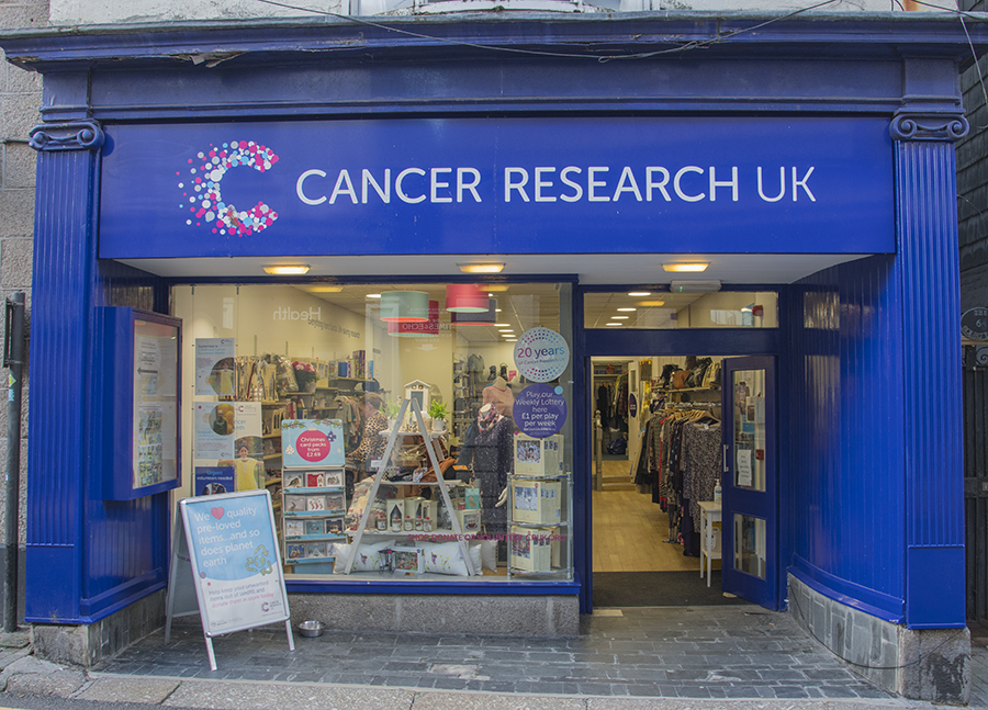 Photo of the storefront of the Cancer Research UK charity shop in St Andrews, Scotland