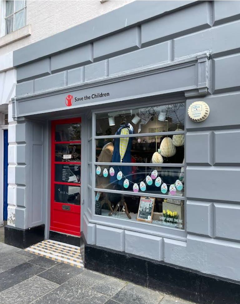 Photo of the storefront of the Save the Children charity shop in St Andrews, Scotland