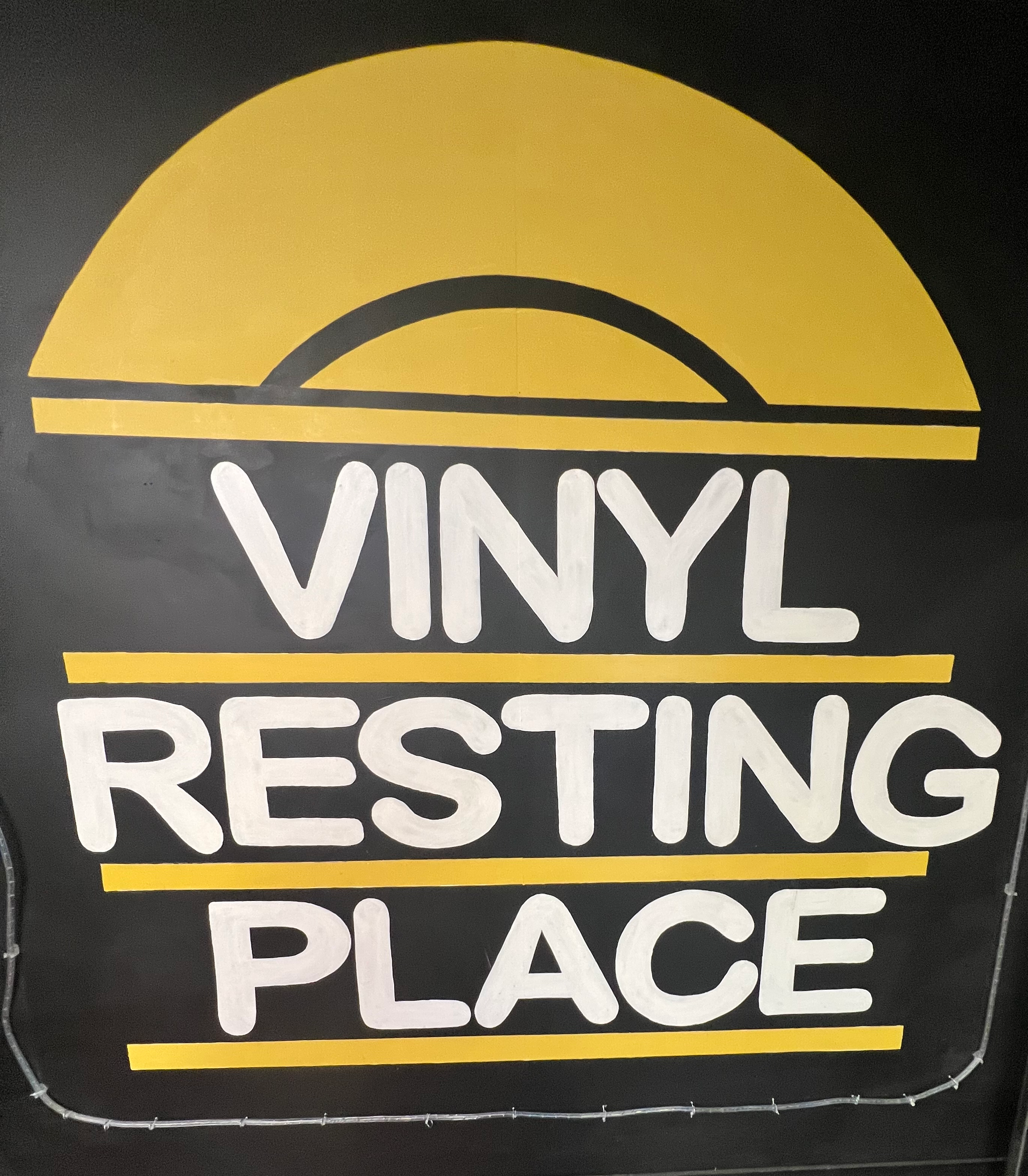 The logo of Vinyl Resting Place in Afflecks in Manchester