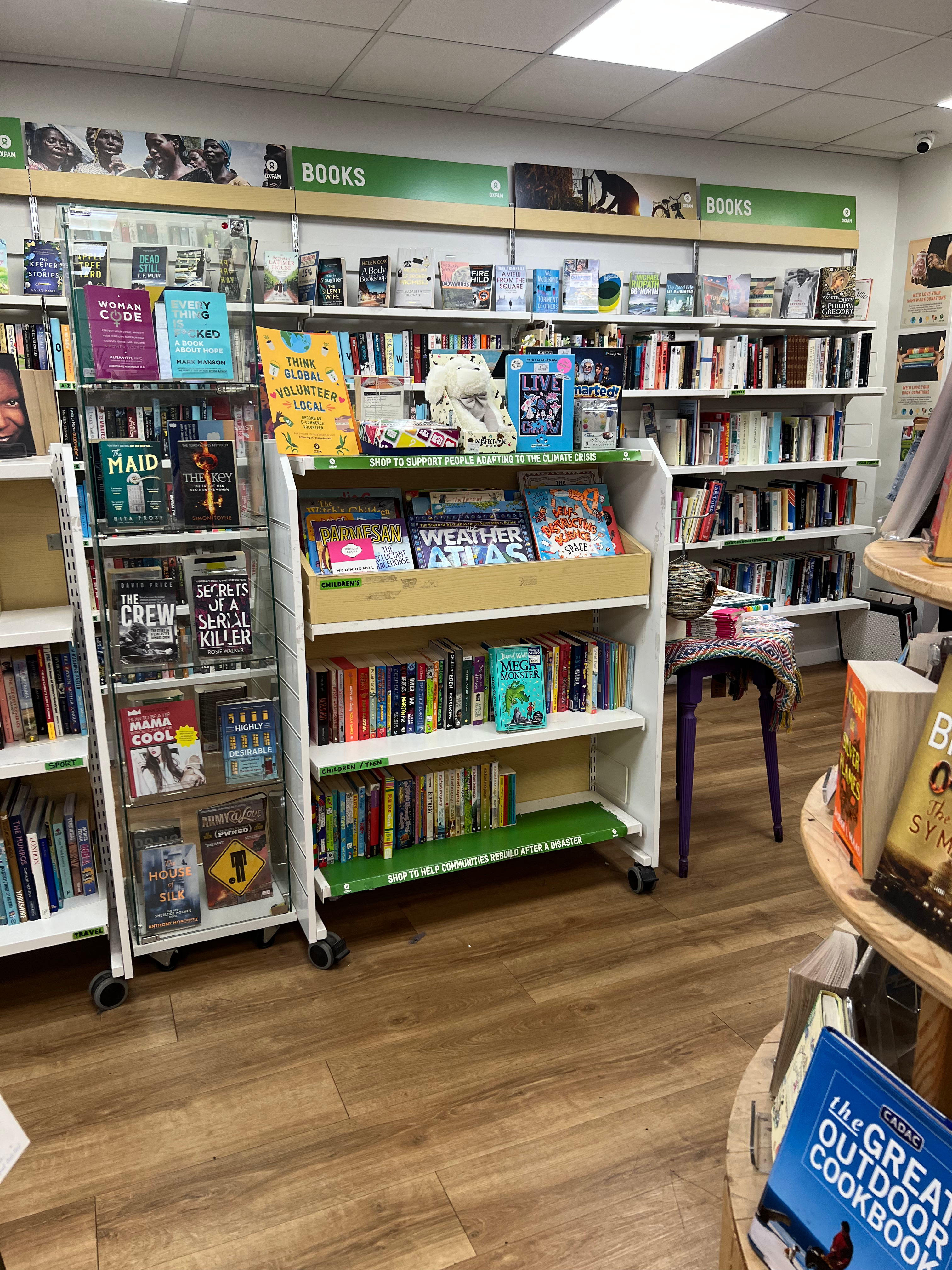 A picture of the shelves inside an Oxfam bookstore in the center of Manchester