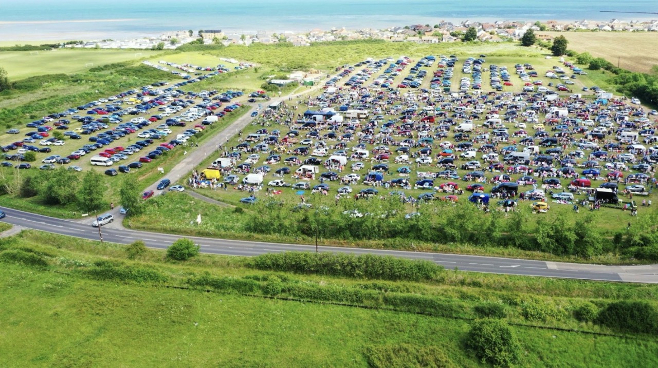 A drone shot of the K&T Boot Fairs field filled with cars and people