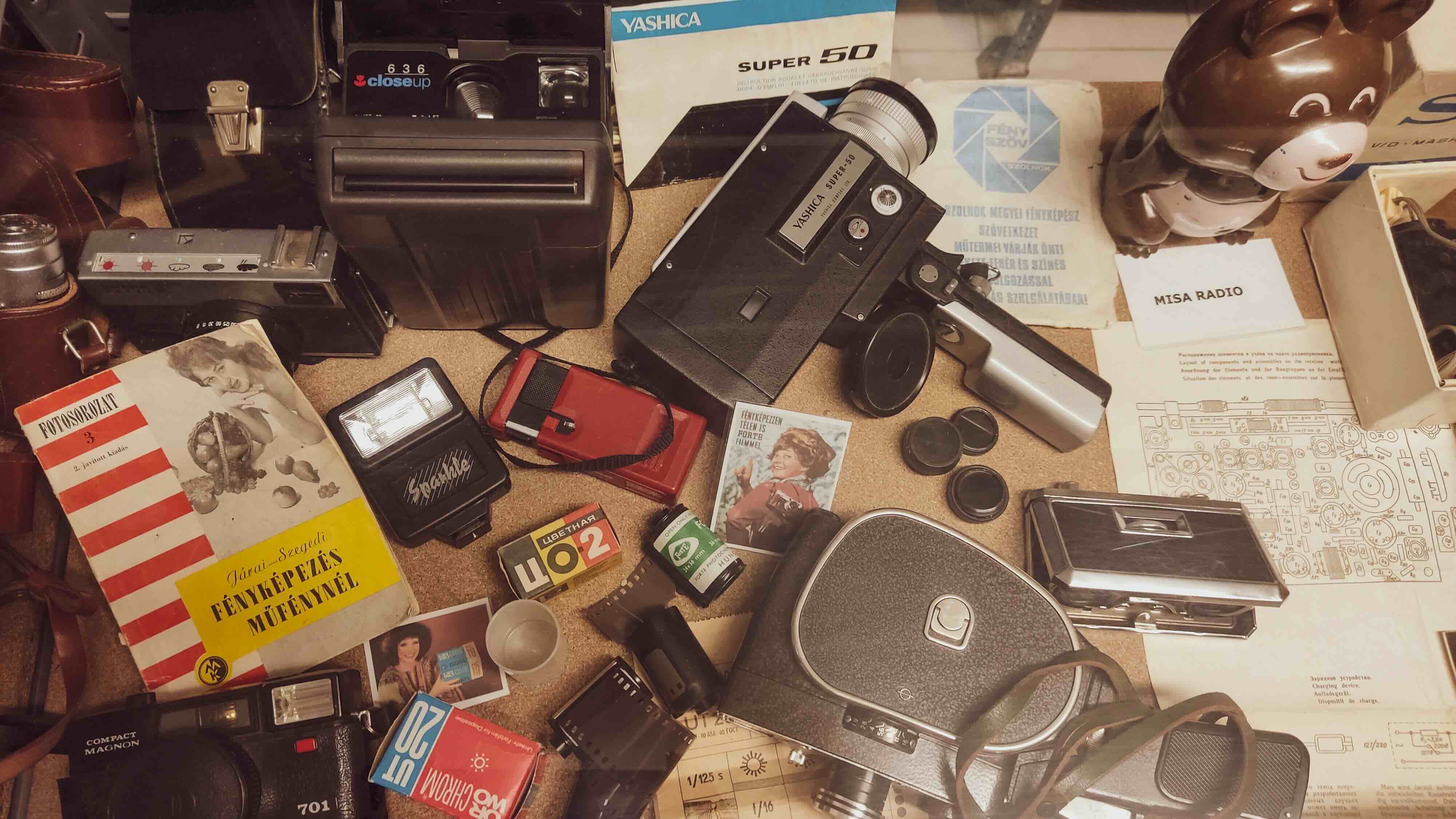 A table with a range of retro items like retro books, retro cameras etc.