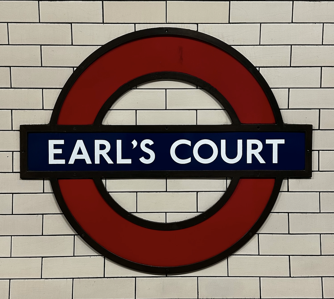 The Earl's Court Underground station roundel sign in West London
