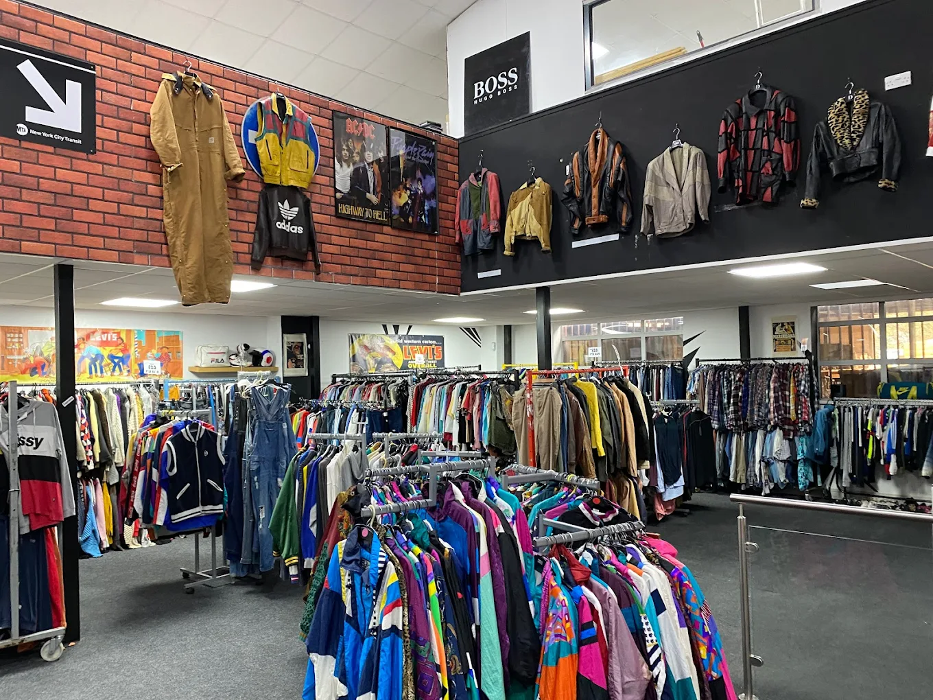 Vintage clothing store interior with racks of colourful retro jackets and wall displays